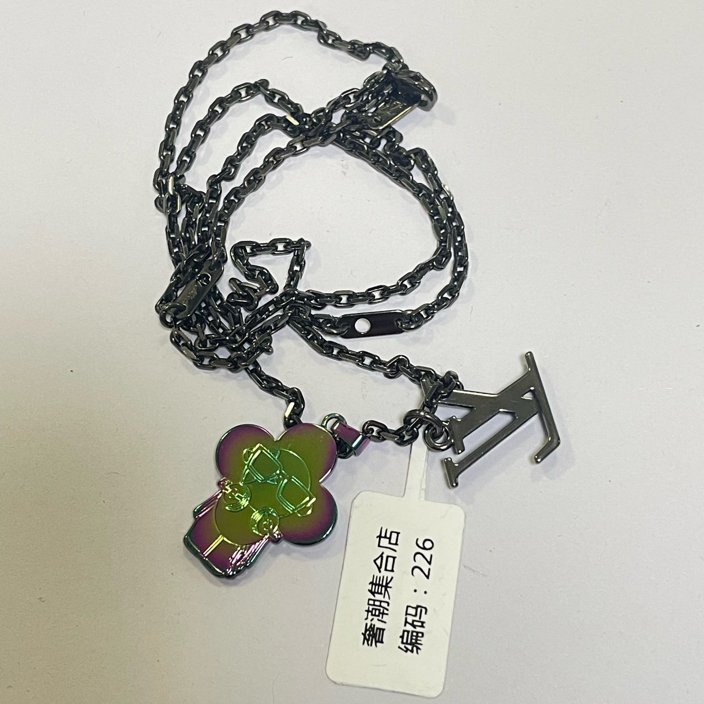 Louis Vuitton Metal Silver Pendant