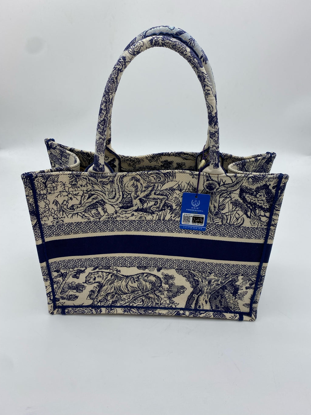 Dior Book Tote Blue Dimensions: 26.5 x 21 x 14 cm (length x height x width); length from handle top to bag top: 12 cm M1265ZRGO_M35I