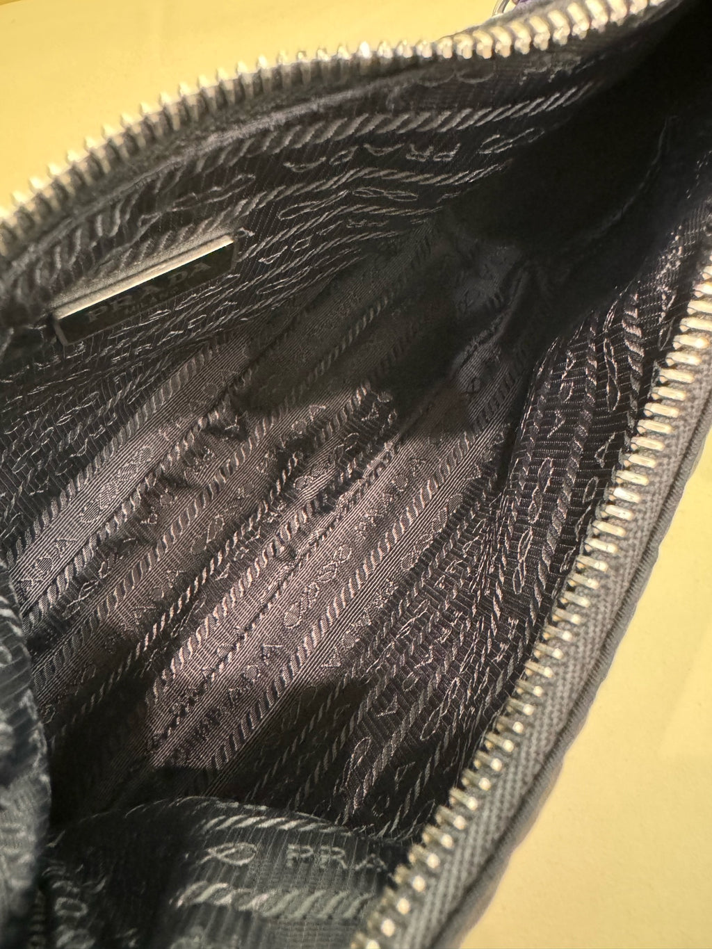 PRADA Prada Re-Edition 2005 Recycled Nylon and Saffiano Leather Handbag Black 18×22×6cm 1BH204_R064_F0002_V_WRK