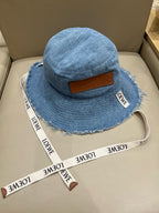 Loewe Tannin-dyed canvas and cowhide raw-edge fisherman hat Brown Bucket hat K820HF1X66-5400