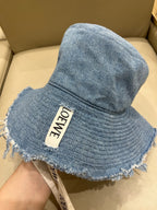 Loewe Tannin-dyed canvas and cowhide raw-edge fisherman hat Brown Bucket hat K820HF1X66-5400