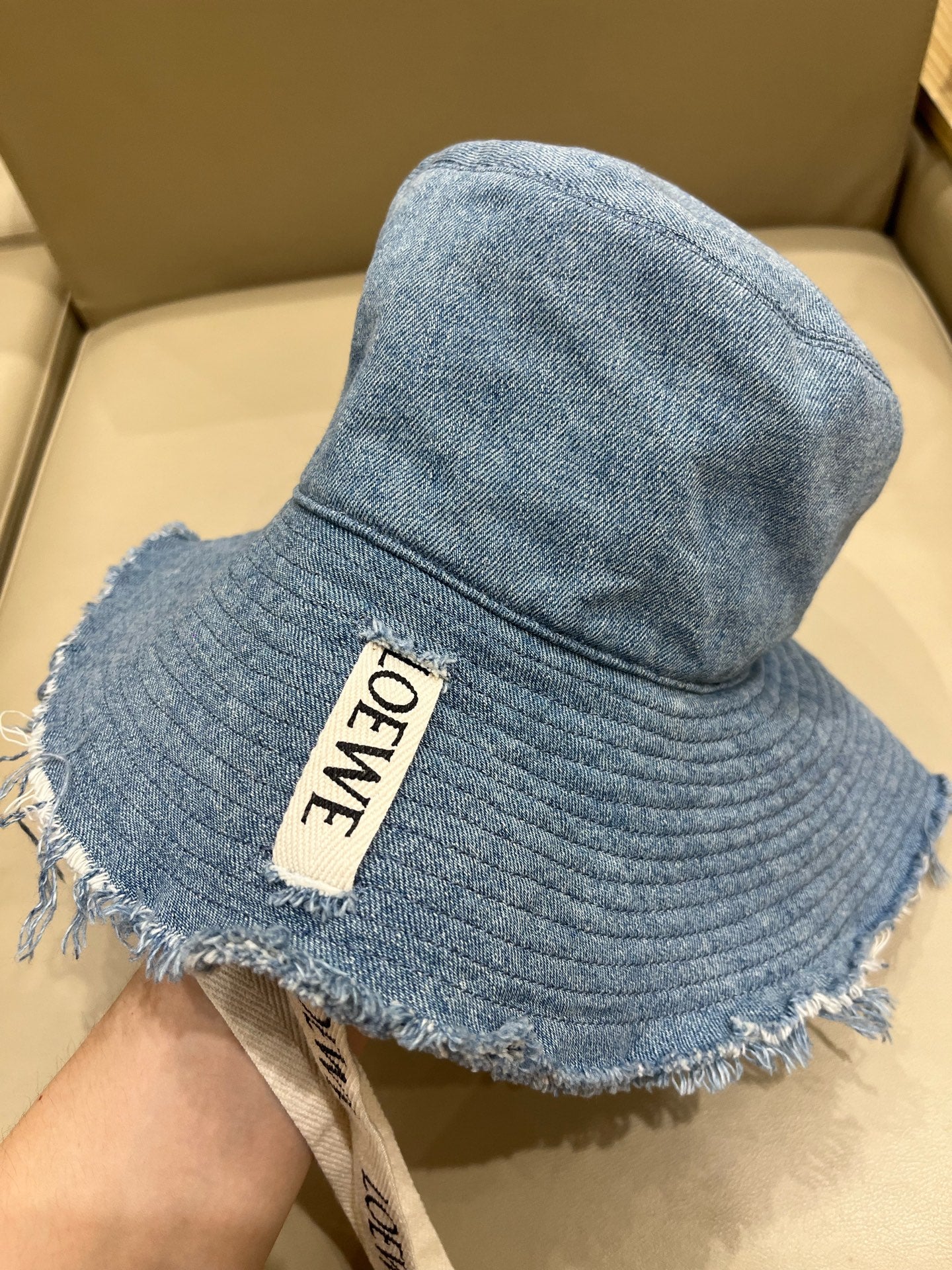 Loewe Tannin-dyed canvas and cowhide raw-edge fisherman hat Brown Bucket hat K820HF1X66-5400