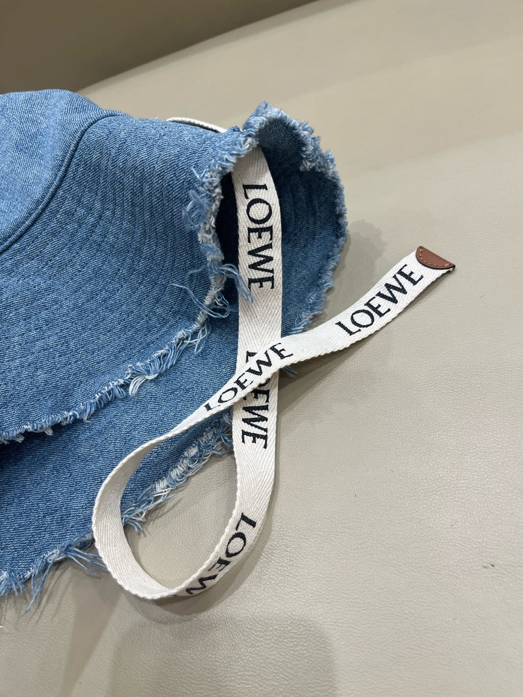 Loewe Tannin-dyed canvas and cowhide raw-edge fisherman hat Brown Bucket hat K820HF1X66-5400